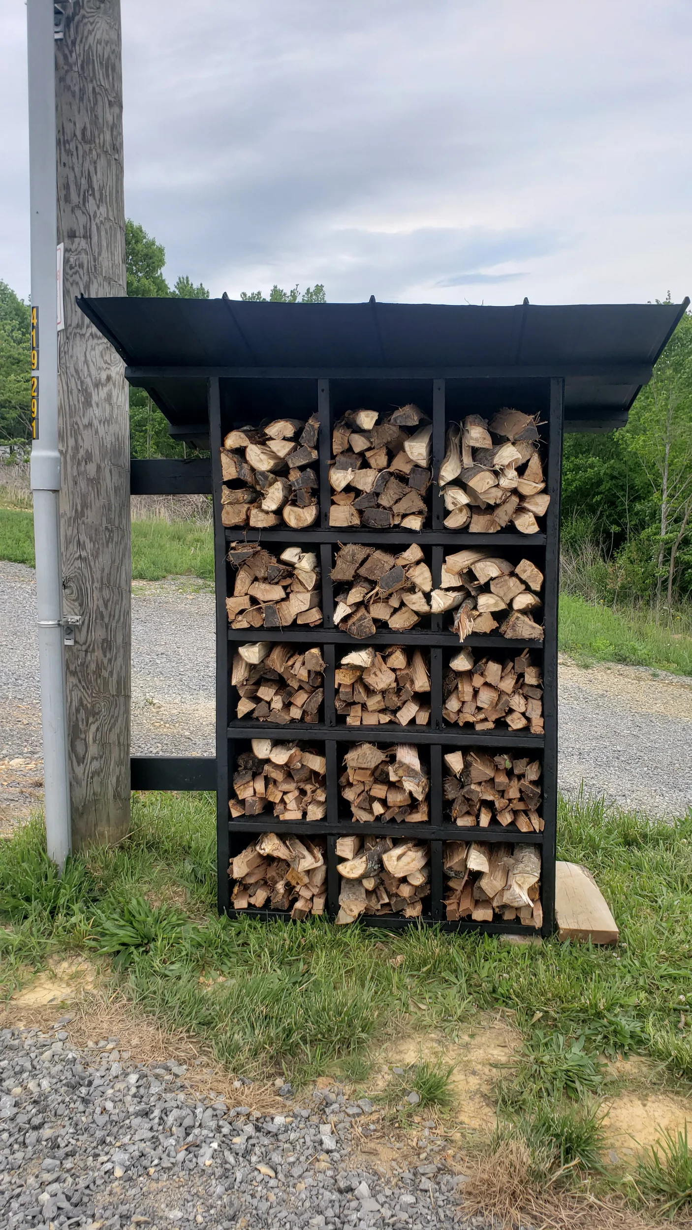 handmade firewood stand filled